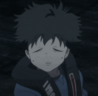a boy in a blue shirt is wearing a life vest around his neck
