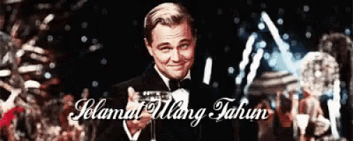 a man in a tuxedo is smiling with the words selamat ulang tahun on the bottom