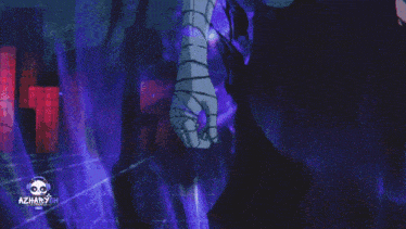 a person is standing in a dark room with a purple light shining on them