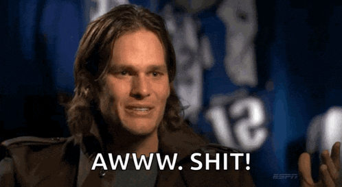 a man with long hair says awww shit in front of a number 12 jersey