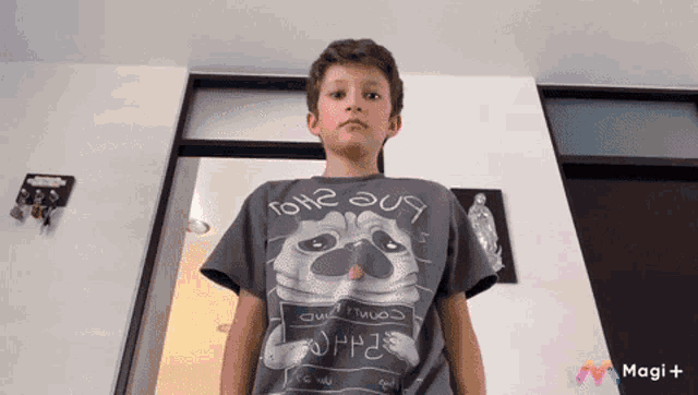 a young boy wearing a t-shirt that says ' i love you ' on it