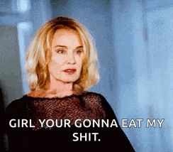 a woman in a black dress is standing in a hallway and saying `` girl your gonna eat my shit '' .