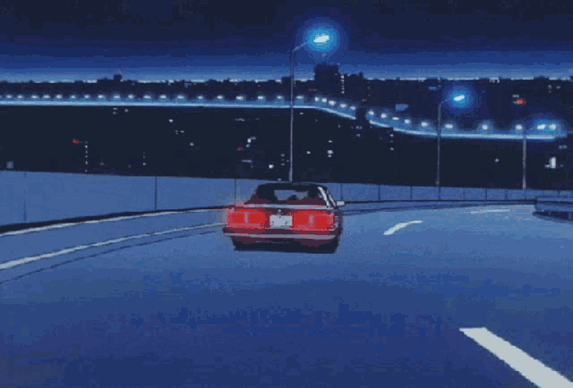 a car is driving down a highway at night and has a license plate that says ' a '