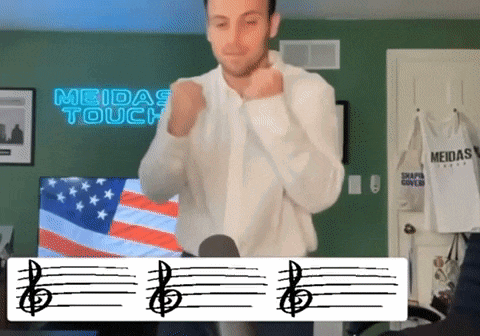 a man is dancing in front of a meidas touch sign