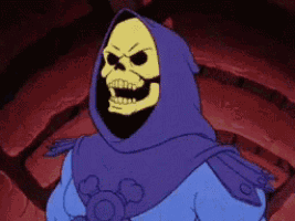 a skeletor from masters of the universe is wearing a purple cape and hood .