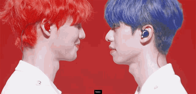 two boys with red and blue hair looking at each other