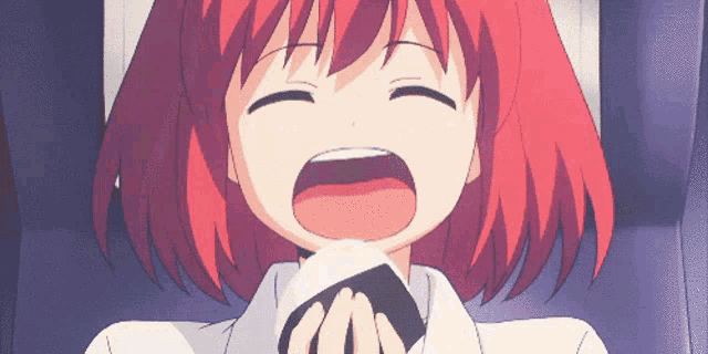a girl with red hair is crying and holding a piece of paper