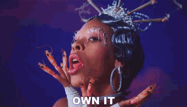 a close up of a woman 's face with the words " own it " above her