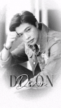 a black and white photo of a young man with the name devon