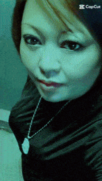 a close up of a woman 's face with a capcut watermark
