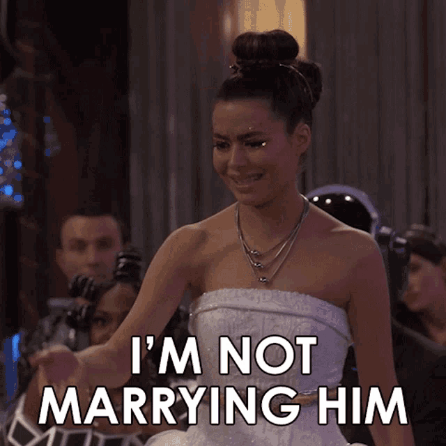 a woman in a wedding dress is crying and says i 'm not marrying him