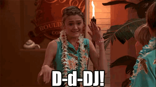 a woman says d-d-dj in front of a sign that says boulder county