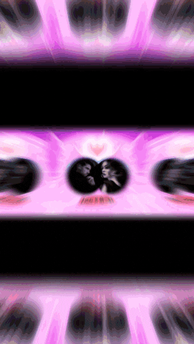 a blurred image of a man and a woman with a heart in the middle