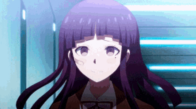 a girl with long purple hair and a bandage on her face is standing in a hallway .