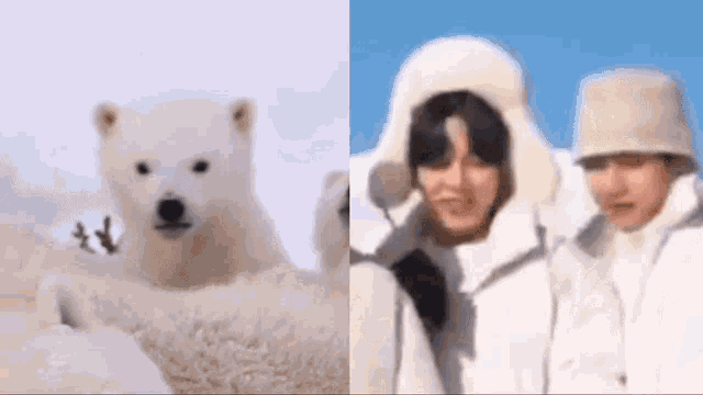 a polar bear cub is sitting next to a couple of people wearing white hats .