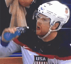 a hockey player wearing a jersey that says usa on the front