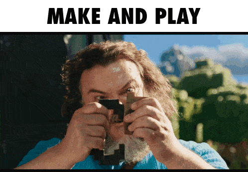 a man with a beard is holding a piece of wood in front of a sign that says " make and play "