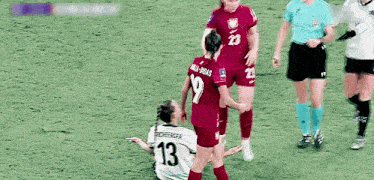 a female soccer player with the number 13 on her back