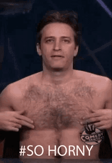 a shirtless man with a comedy central logo on his chest says # so horny