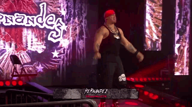 a wrestler named hernandez is standing in the ring