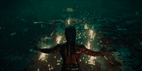 a man with his arms outstretched in the rain