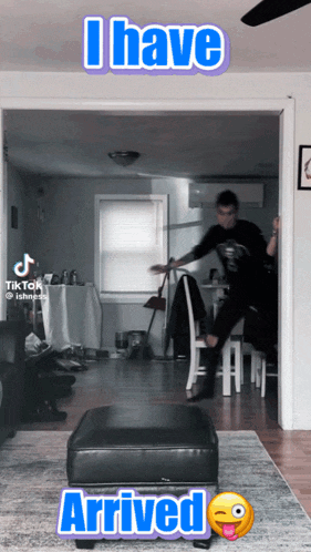 a tiktok video shows a person sitting on a chair and the words " i have arrived " on the bottom