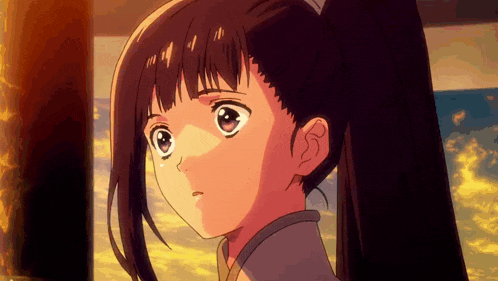 a girl with a ponytail is looking at something