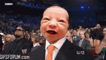 a baby in a suit and tie with a gifs forum.com logo