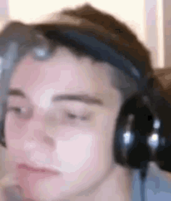 a close up of a person wearing headphones and a headset .