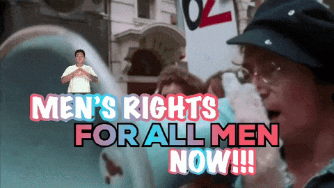 a man is holding a sign that says men 's rights for all men now