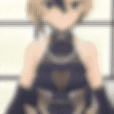 a blurry picture of a blonde anime girl in a blue dress