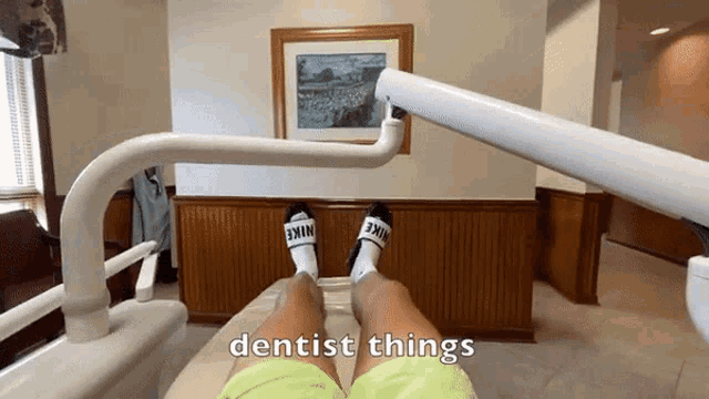 a person is sitting in a dental chair with the words " dentist things " above them