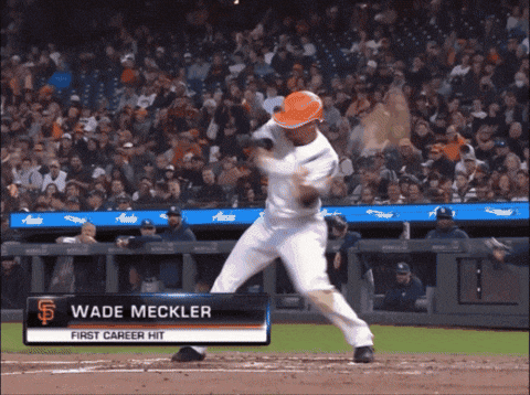 a baseball player named wade mcckler is about to hit a ball