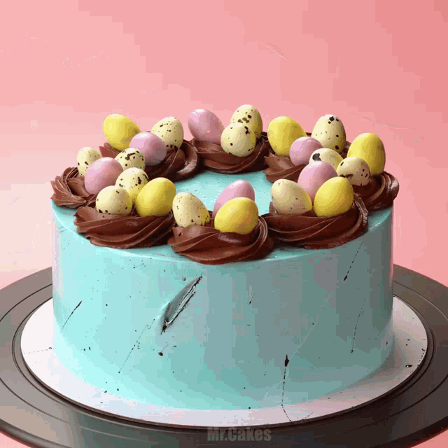 a blue cake with chocolate frosting and easter eggs on top of it