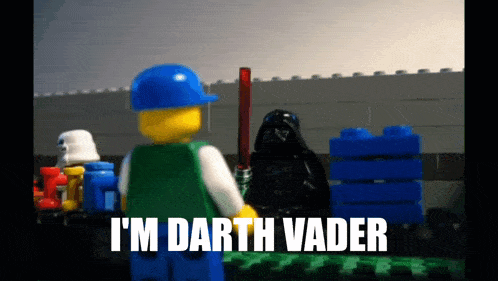a lego character says i 'm darth vader while holding a lightsaber