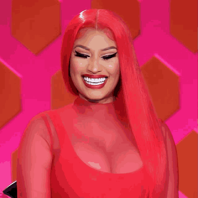 a woman with red hair is wearing a red top and red lipstick