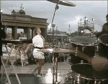 a woman is dancing on a stage in front of a crowd and the words kultur hd are on the bottom right