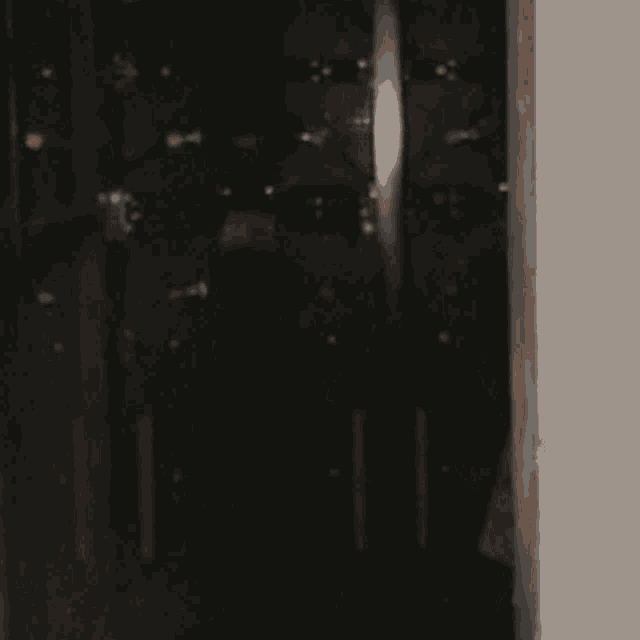 a blurred image of a woman with red lipstick