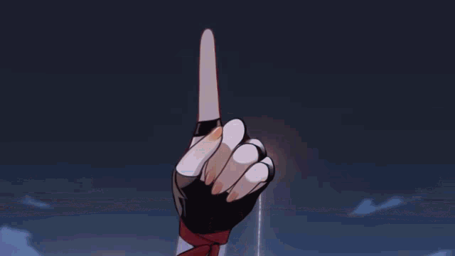 a blurry picture of a girl giving a peace sign with her hand .