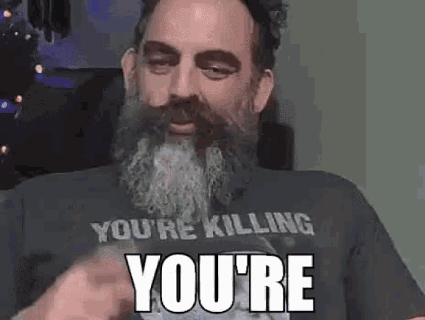 a man with a beard wearing a t-shirt that says `` you 're killing you 're ''