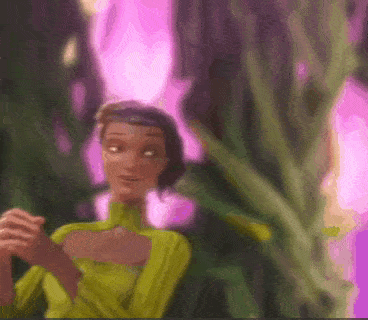 a woman in a green dress is standing in front of a purple background .