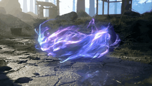 a purple flame is floating in the air