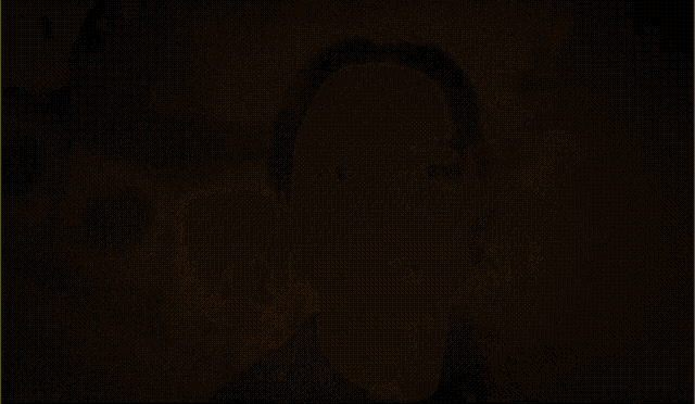 a black background with orange smoke coming out of the top