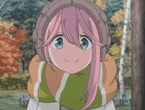 a girl with pink hair and blue eyes is wearing a scarf and a hat
