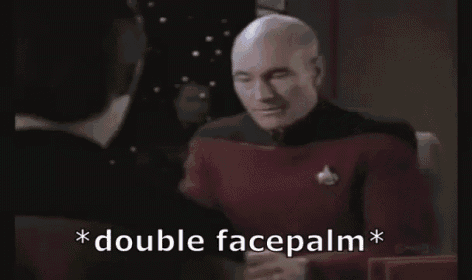 a man is sitting at a table with his hands in his pockets and the words `` double facepalm '' above him .