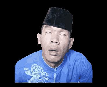 a man wearing a black hat and a blue shirt is making a face
