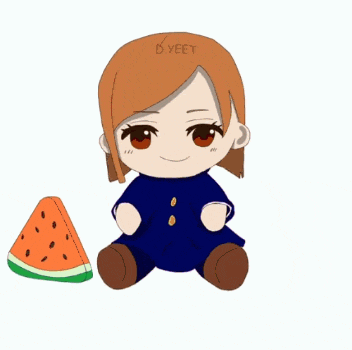 a stuffed animal sitting next to a slice of watermelon
