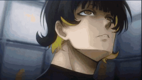 a close up of a person 's face with a yellow stripe on their hair .