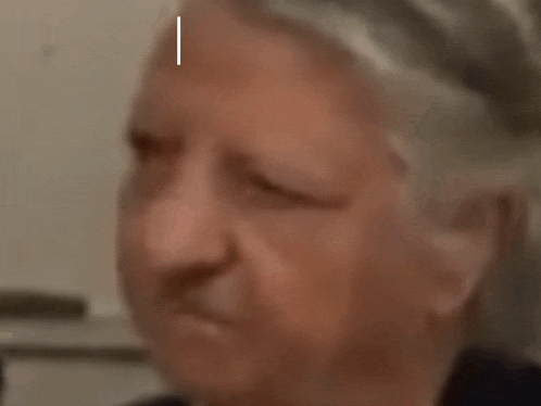 a close up of a woman 's face with the word ah written on her forehead