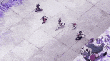 a group of people are walking on a sidewalk and one of them has a skull on her chest